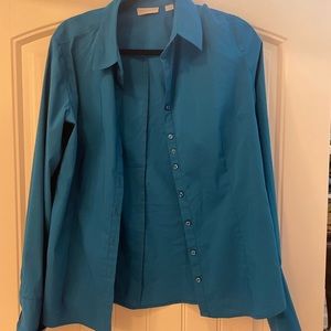 Woman’s long sleeve button down blouse.